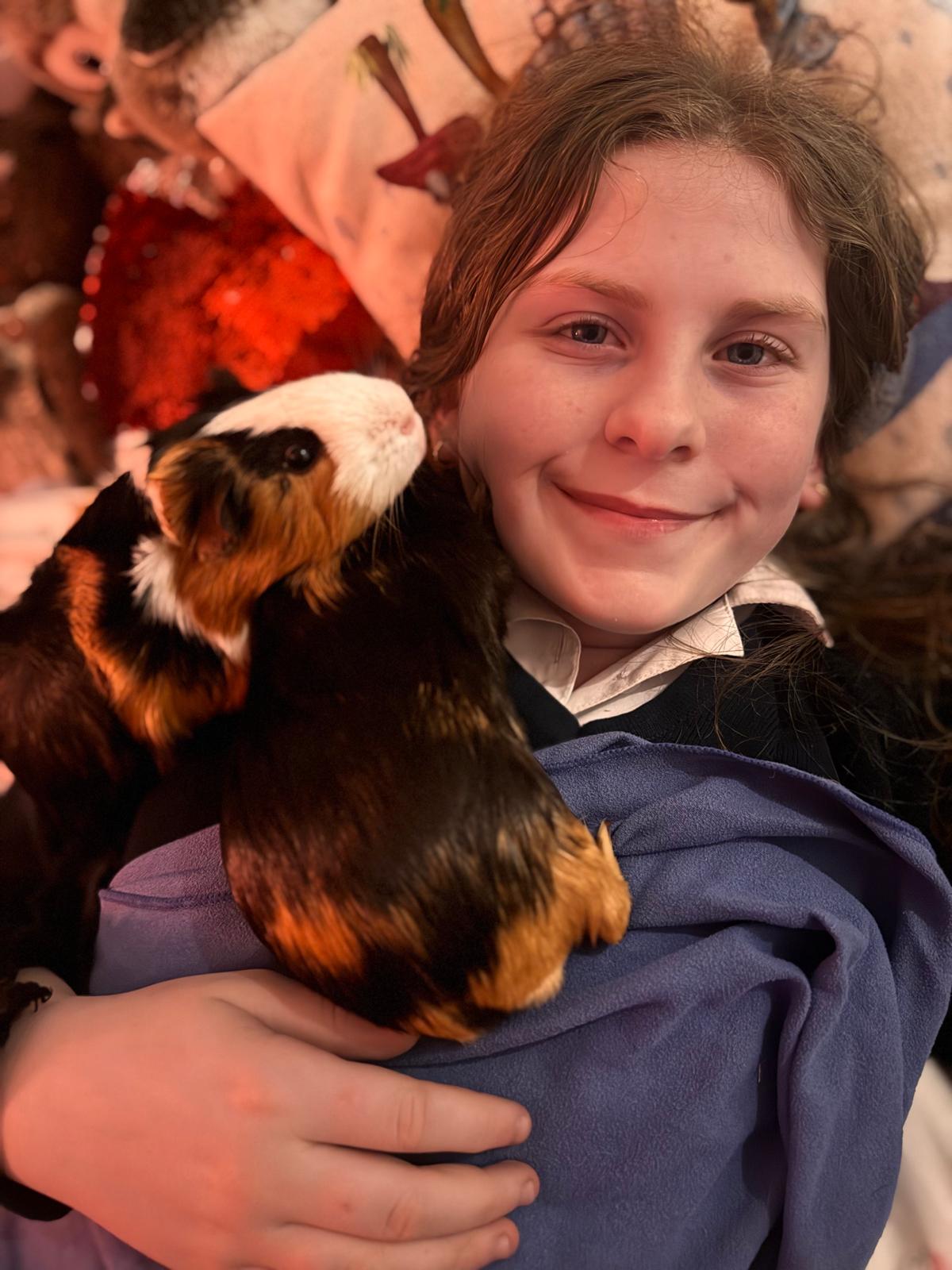 Daughter cuddling Jet